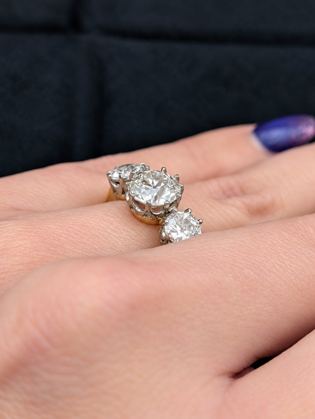 Profile view showing the old European cut diamonds and handcrafted platinum crown prongs