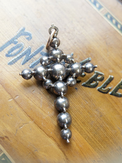 Gold, silver and paste crucifix pendant