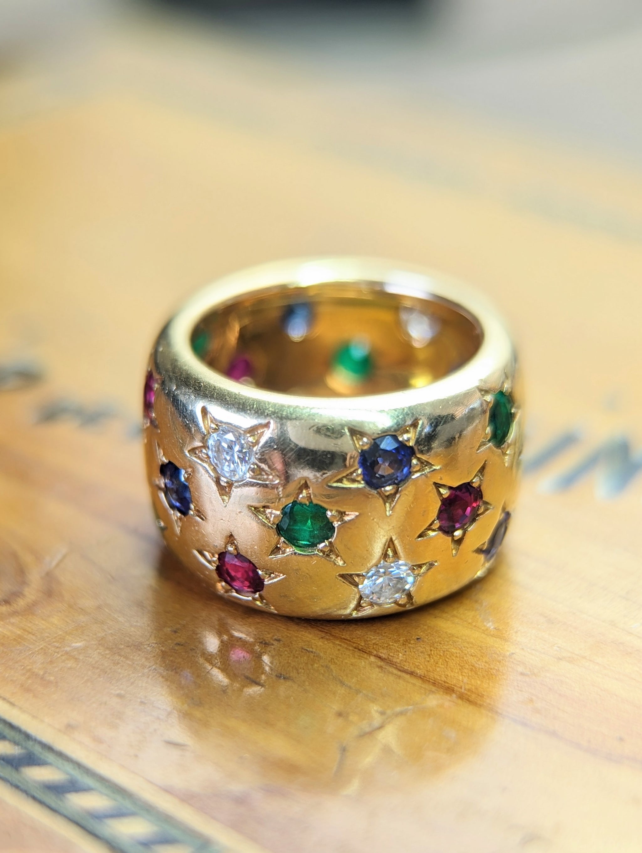 Cartier star diamond, ruby, emerald, sapphire band Sin City