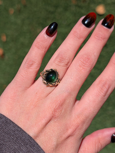 Vintage green tourmaline ring worn on a hand