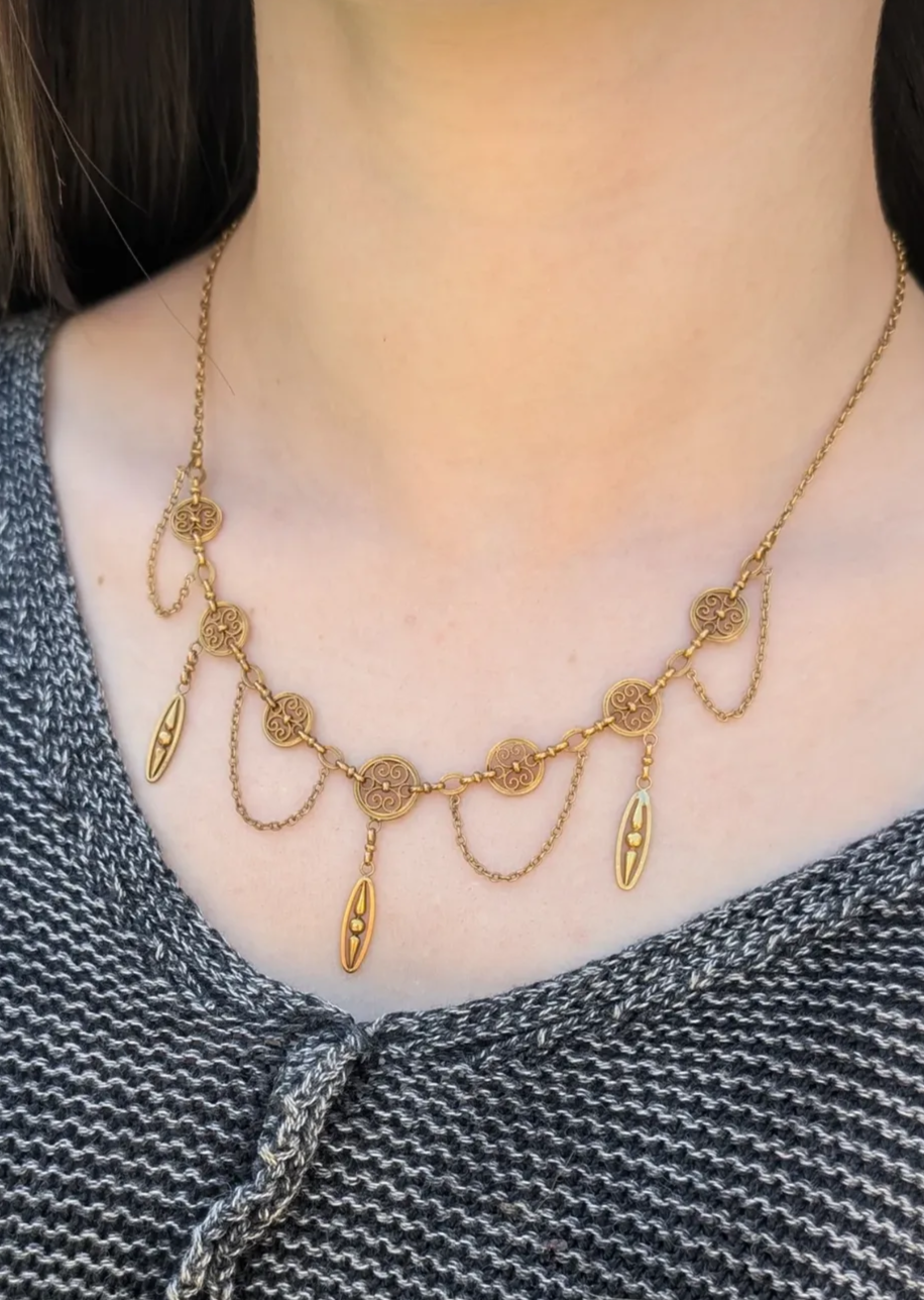 French 18K gold festoon necklace shown worn