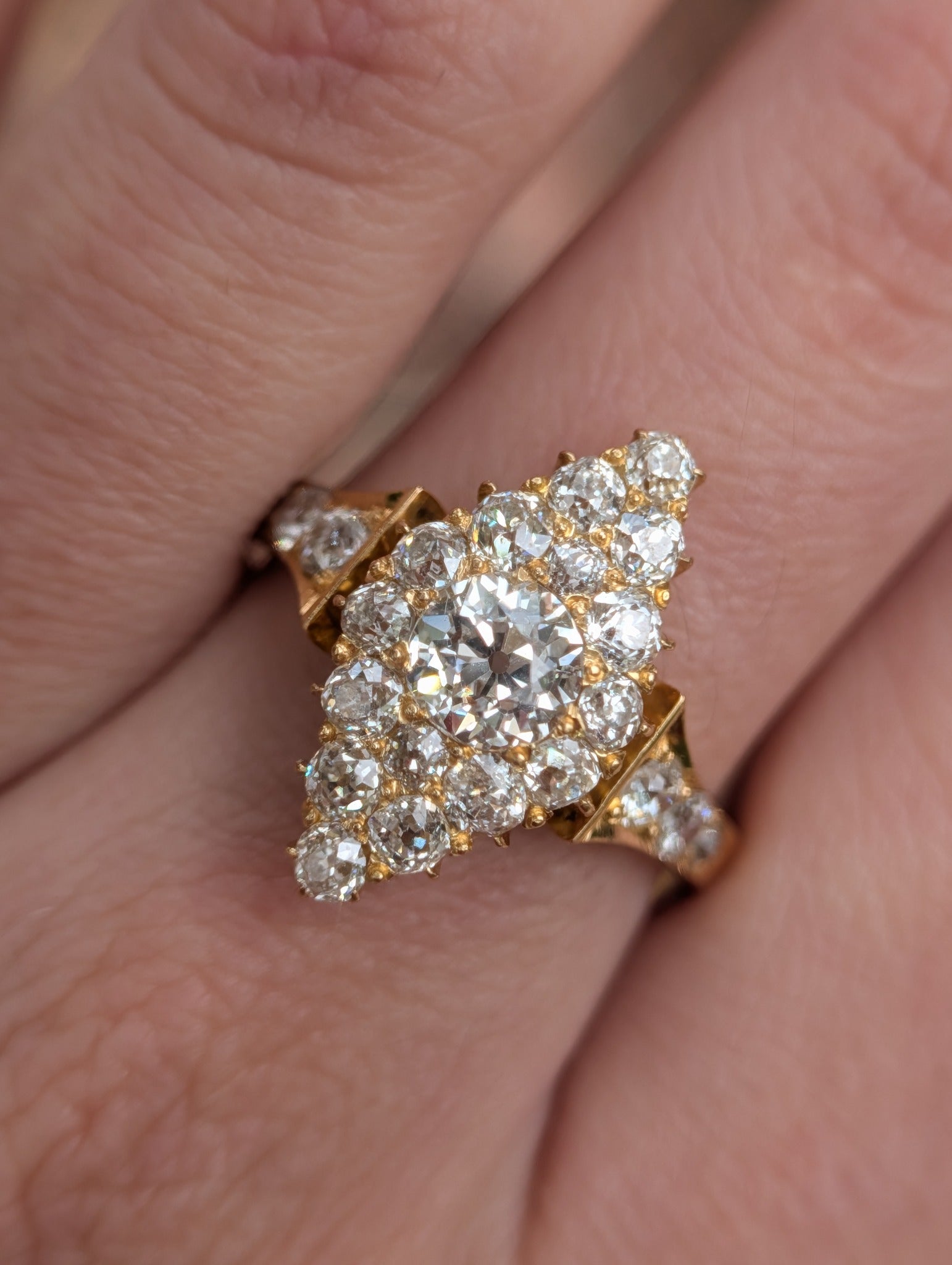 Antique diamond navette ring worn at an angle