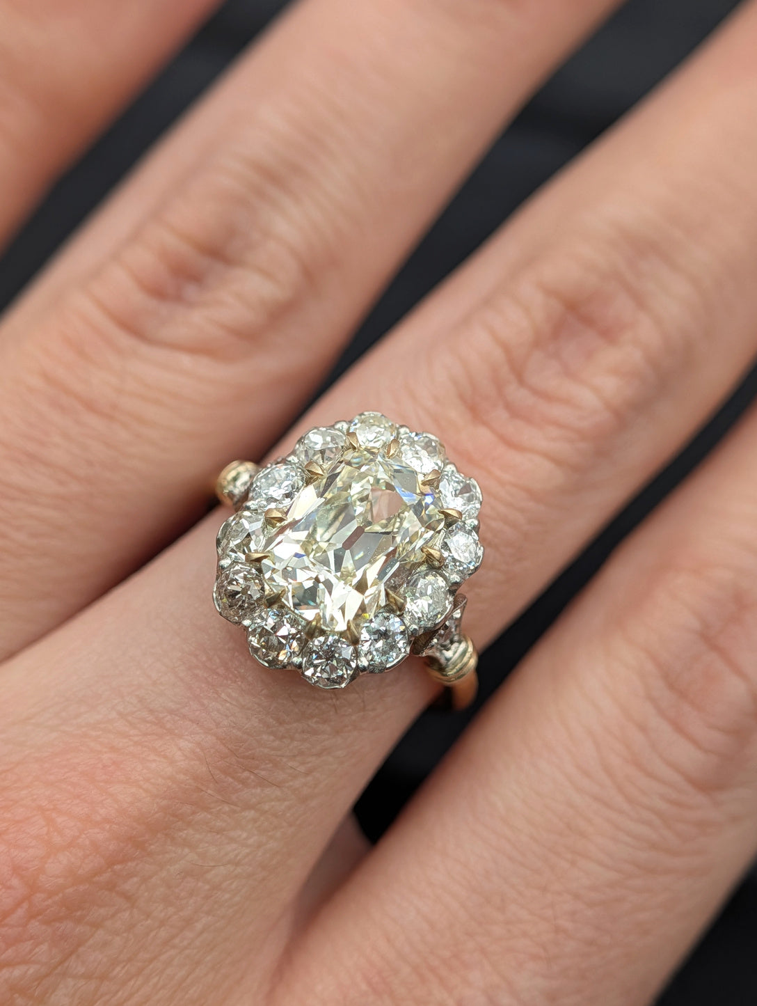 Cushion diamond halo ring worn on the hand, view 2