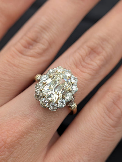 Cushion diamond halo ring worn on the hand, view 2