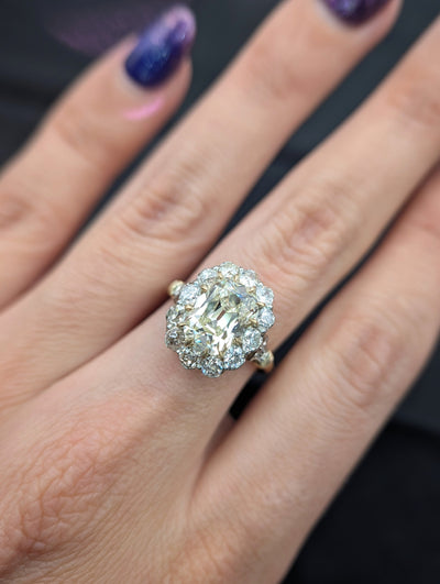 Cushion diamond halo ring worn on the hand, view 3