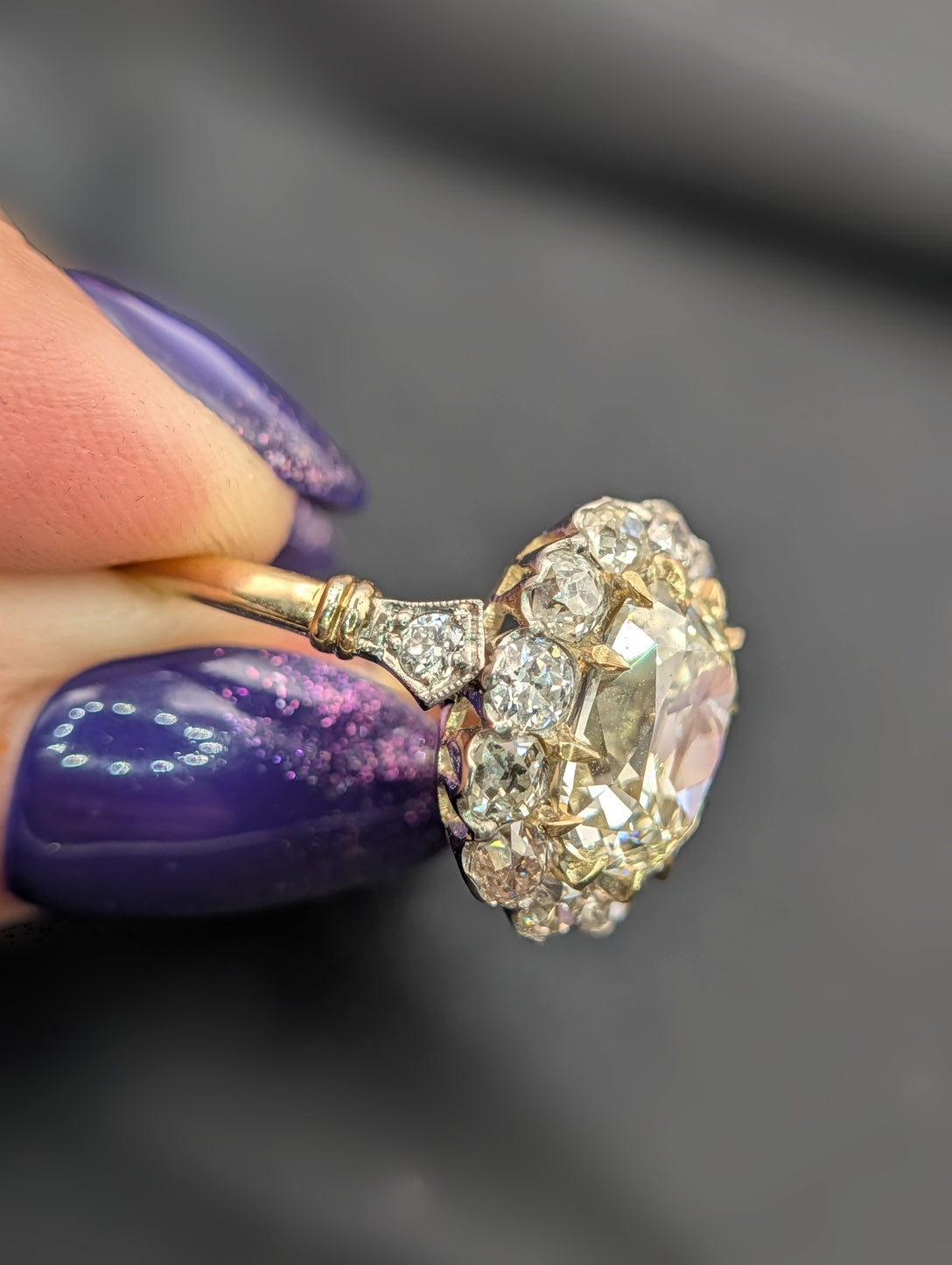 Side profile showing the diamond shoulder and gold band