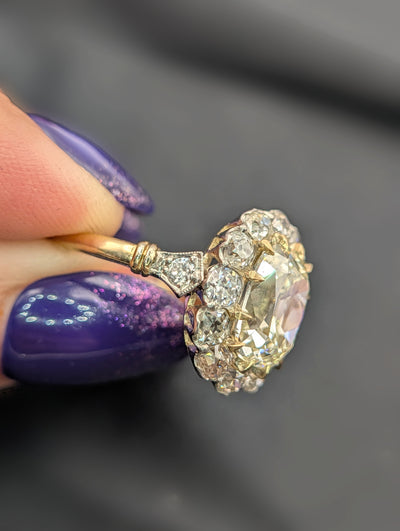 Side profile showing the diamond shoulder and gold band