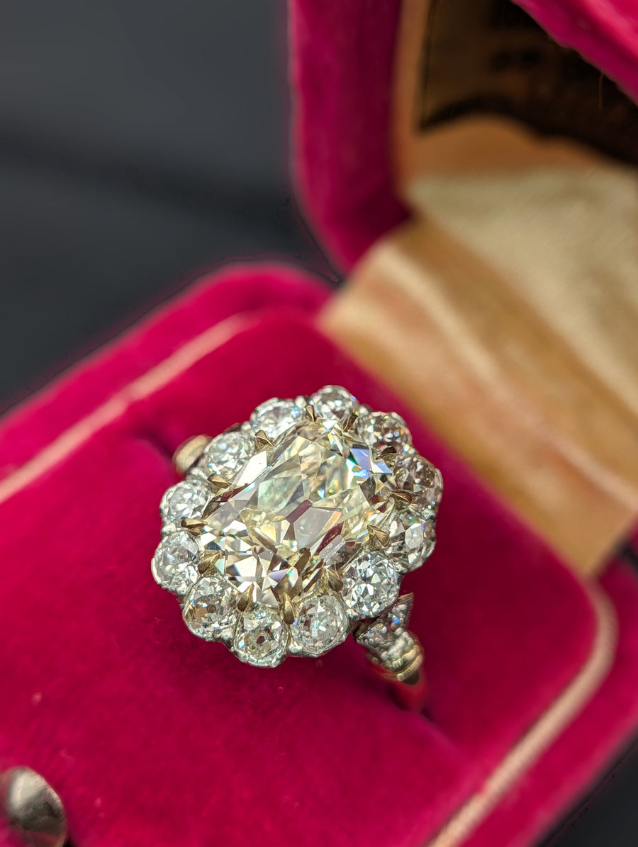 Cushion diamond halo ring in red velvet box, view 5