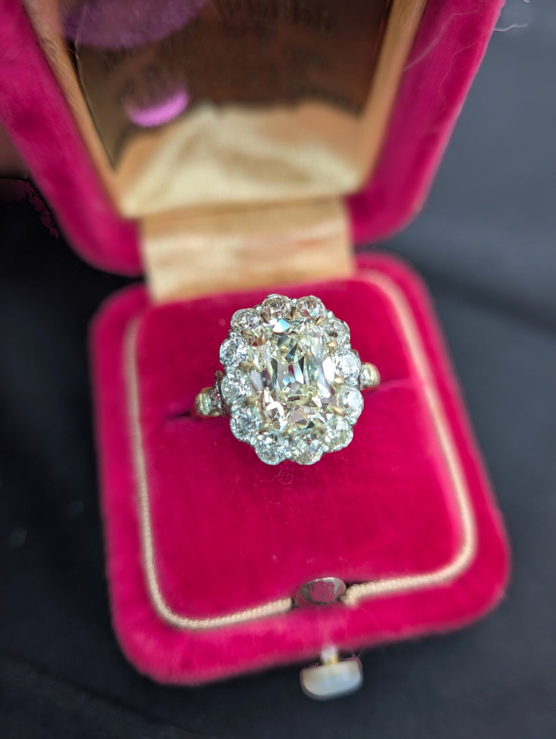 Cushion diamond halo ring in red velvet box, view 7