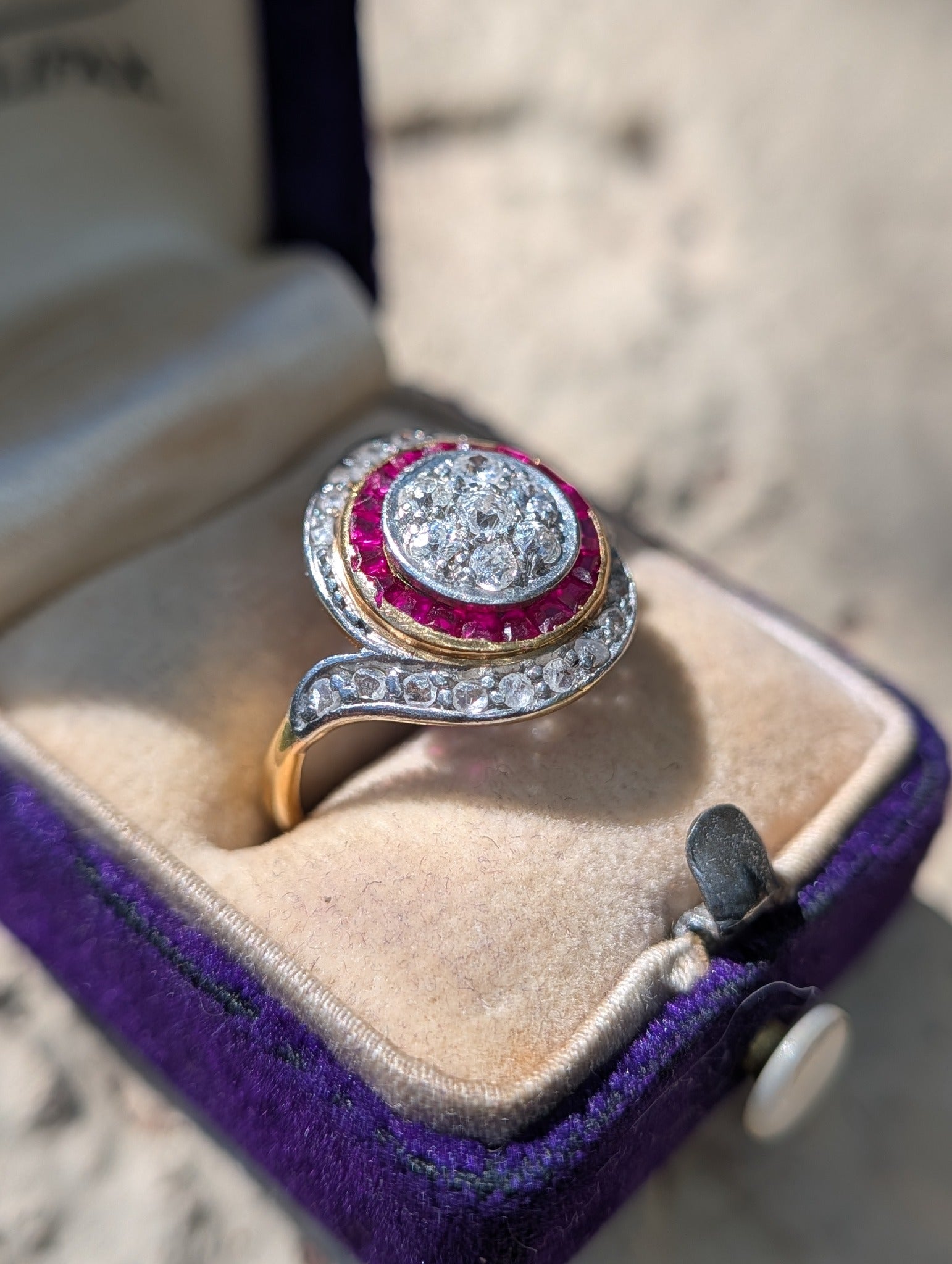 Angled view showing the ring's low delicate profile and rose-cut diamond sides