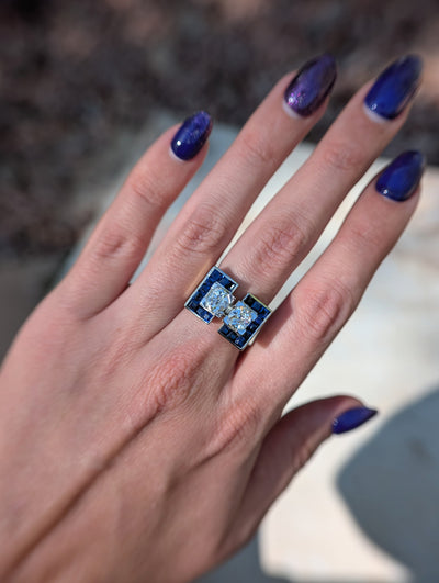 Full hand view of the French diamond and synthetic sapphire tank ring showing scale