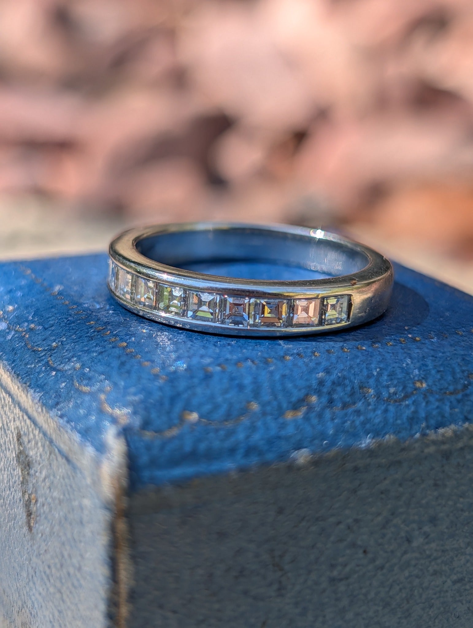Tiffany & Co. platinum carré-cut diamond half eternity band, angled view