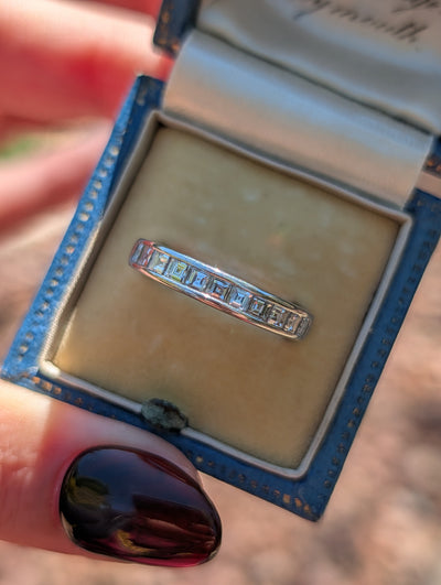 Tiffany & Co. platinum diamond half eternity band in natural light