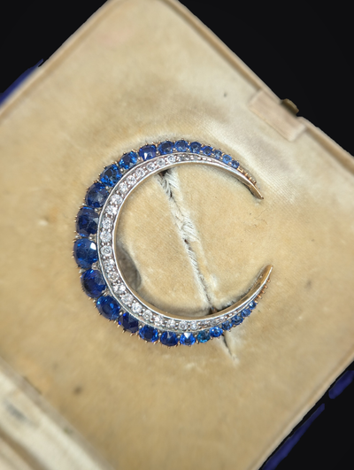 Detailed sapphire and antique diamond crescent in original fitted box