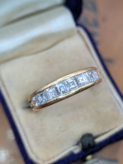 Angled view of the Boucheron diamond band in its box